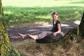 Girl sitting on tire