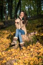 Girl sitting on tree stump Royalty Free Stock Photo