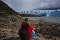 Girl sitting and watching to Perito Moreno Glacier after hike Royalty Free Stock Photo