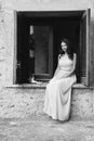 Girl sitting on the window with cat Royalty Free Stock Photo