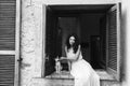 Girl sitting on the window with cat Royalty Free Stock Photo