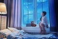 Girl sitting at the window Royalty Free Stock Photo