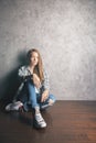 Girl sitting on wooden floor Royalty Free Stock Photo