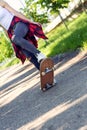 Girl skateboarder - sporty legs skateboarding in park