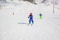 Girl Alpine ski downhill in learning position Royalty Free Stock Photo