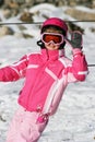 Girl ski skiing smiling winter snow rest vocation pink children kid trip travel Royalty Free Stock Photo