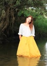 Girl in skirt in water Royalty Free Stock Photo