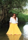 Girl in skirt in water Royalty Free Stock Photo