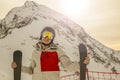 Girl with skis in helmet and mask on the background of mountains toned Royalty Free Stock Photo
