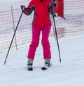 A girl skis on the snow in winter