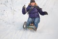 Girl sledging down hill Royalty Free Stock Photo