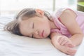 Girl sleeping on bed at day time Royalty Free Stock Photo