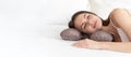 A girl sleeping on a special beauty pillow with a silk pillowcase. Banner Royalty Free Stock Photo