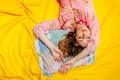 Girl sleeping on the yellow sheet