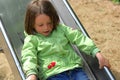 Girl sliding chute Royalty Free Stock Photo