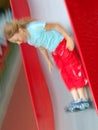 Girl sliding on slide Royalty Free Stock Photo