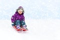 Girl Sliding in Snow Royalty Free Stock Photo