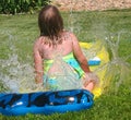 Girl on Slip and Slide Royalty Free Stock Photo