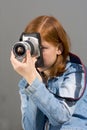 Girl with SLR photo camera Royalty Free Stock Photo