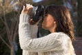 Girl with SLR photo camera Royalty Free Stock Photo