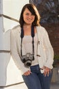 Girl with SLR photo camera Royalty Free Stock Photo