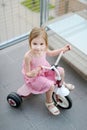 A girl on a small bike