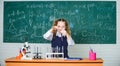 Girl smart student conduct school experiment. School pupil study chemical liquids. School chemistry lesson. Test tubes Royalty Free Stock Photo