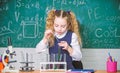 Girl smart student conduct school experiment. School pupil study chemical liquids. School chemistry lesson. Test tubes Royalty Free Stock Photo