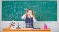 Girl smart student conduct school experiment. School pupil study chemical liquids. School chemistry lesson. Test tubes Royalty Free Stock Photo