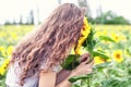 The girl smells sunflowers Royalty Free Stock Photo