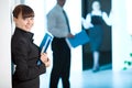 Girl with smile with blue folder