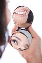 Girl smile and eye reflection on hand mirror Royalty Free Stock Photo