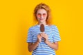 girl smile with icelolly ice cream isolated on yellow. girl with icelolly ice cream in studio.