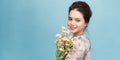 The girl smiles with a bouquet of flowers Royalty Free Stock Photo