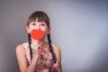 The girl smiles and closes a mouth heart Royalty Free Stock Photo