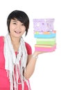 A girl smiling with carrying pile of presents