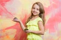 Girl smiling with cupcakes in hands Royalty Free Stock Photo