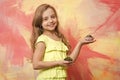 Girl smiling with cupcakes in hands Royalty Free Stock Photo