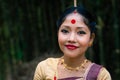 Girl smiling face isolated dressed in traditional wearing on festival with blurred background