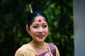 Girl smiling face isolated dressed in traditional wearing on festival with blurred background