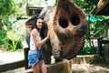 Smiling girl with elephant