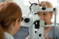 Girl smiling while having eye sight consultation Royalty Free Stock Photo