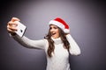 Girl smiling and making selfie on mobile phone Royalty Free Stock Photo