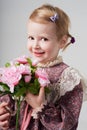 Girl smiling with pink flowers Royalty Free Stock Photo