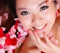 Girl smiling and touch face with red rose Royalty Free Stock Photo
