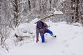 Girl sneaks through a large snowdrift