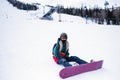 Girl with a snowboard on a snowy slope. Sport. Royalty Free Stock Photo