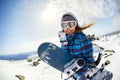 Girl snowboarder enjoys the ski resort