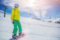 Girl snowboarder having fun in the winter ski resort. Royalty Free Stock Photo