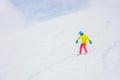 Girl snowboarder having fun in the winter ski resort.